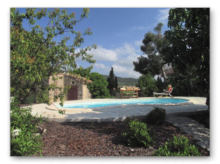 Southern view of the garden, pool, and the valley below